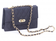 Handbag with flexible shoulder strap