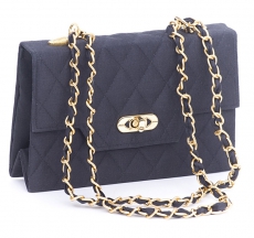 Handbag with flexible shoulder strap